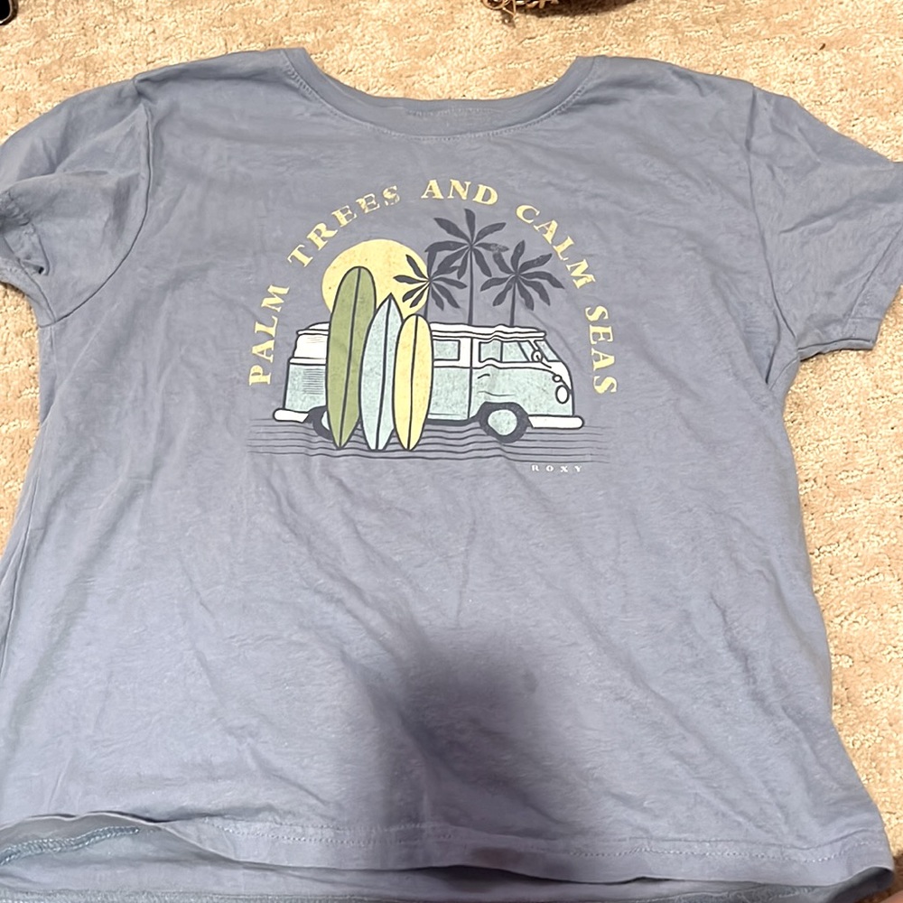 This is a Roxy shirt, xs in womens! Palm trees and a van in the Cover art :)